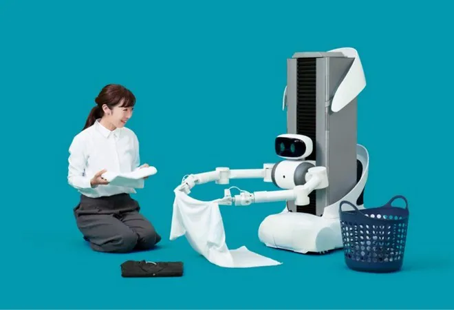 В Японии робота научили развешивать постиранные вещи